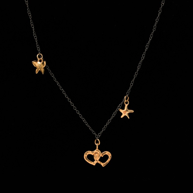 Necklace with a black chain with hearts, stars and a butterfly