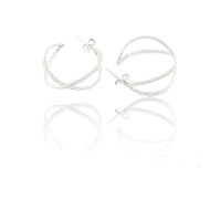 Silver earrings with an elaborate design symbolizing infinity